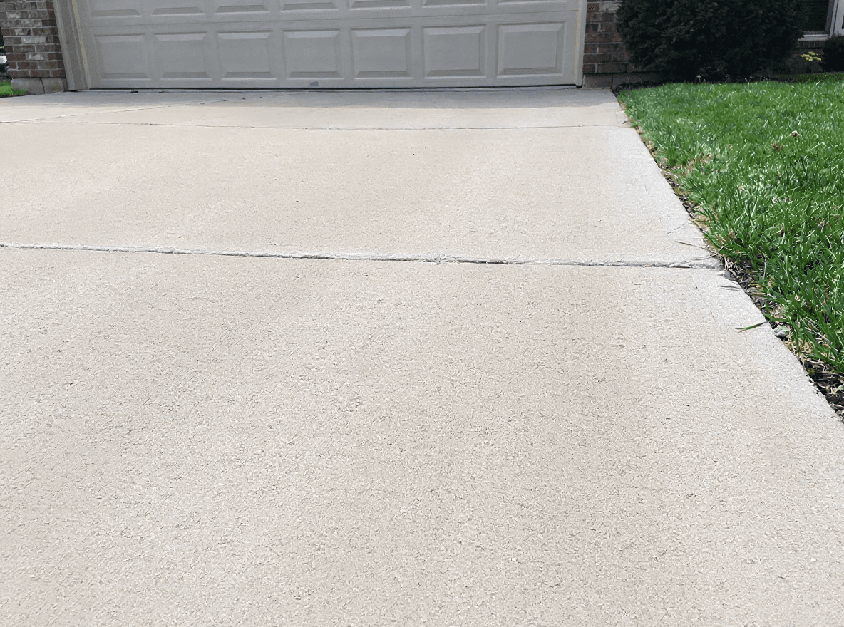 A driveway restored to clean, even concrete after a Brisk wash